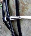 Black and white leather Show Bridle, bBrowband Black and white leather Show Bridle, white trim lack and white white trim matching show reins.