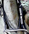 Black and white leather Show Bridle, bBrowband Black and white leather Show Bridle, white trim lack and white white trim matching show reins.